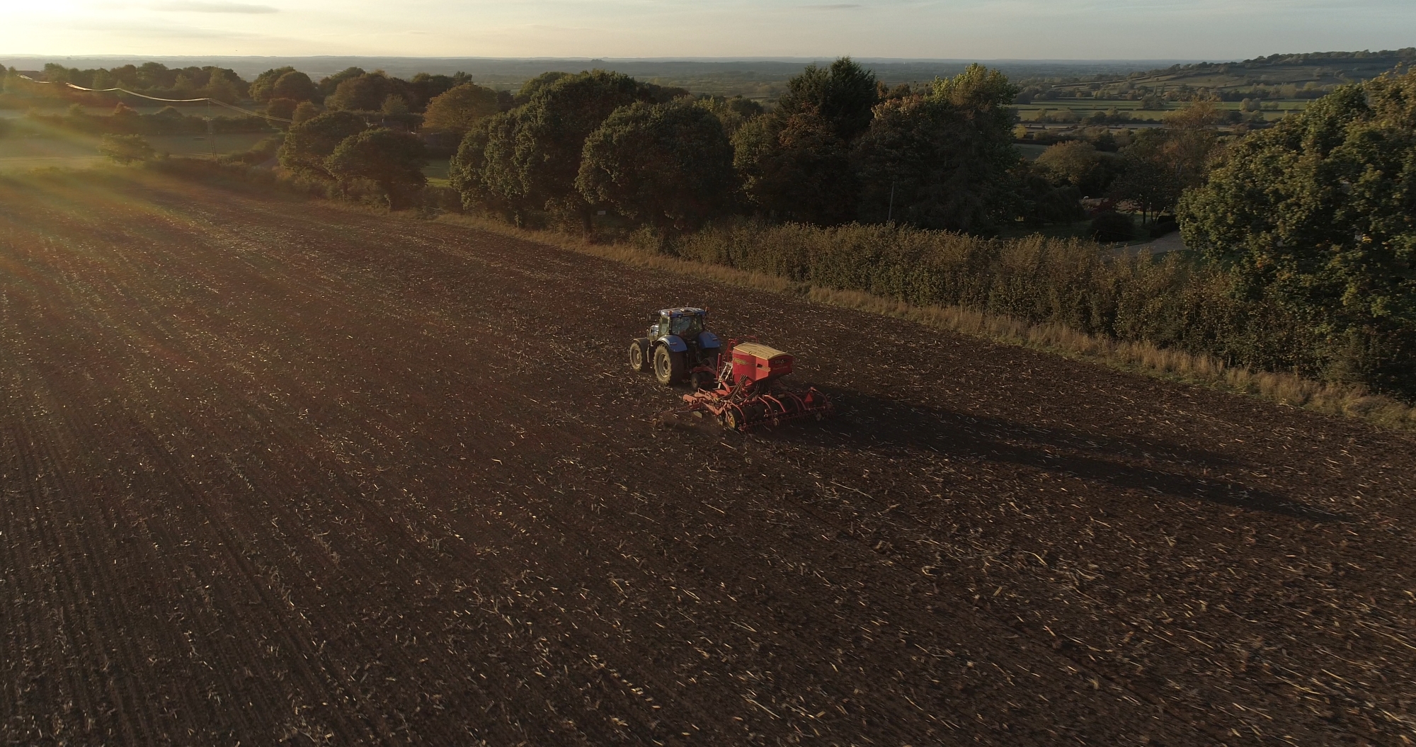 aerial photograph tractor at sunset